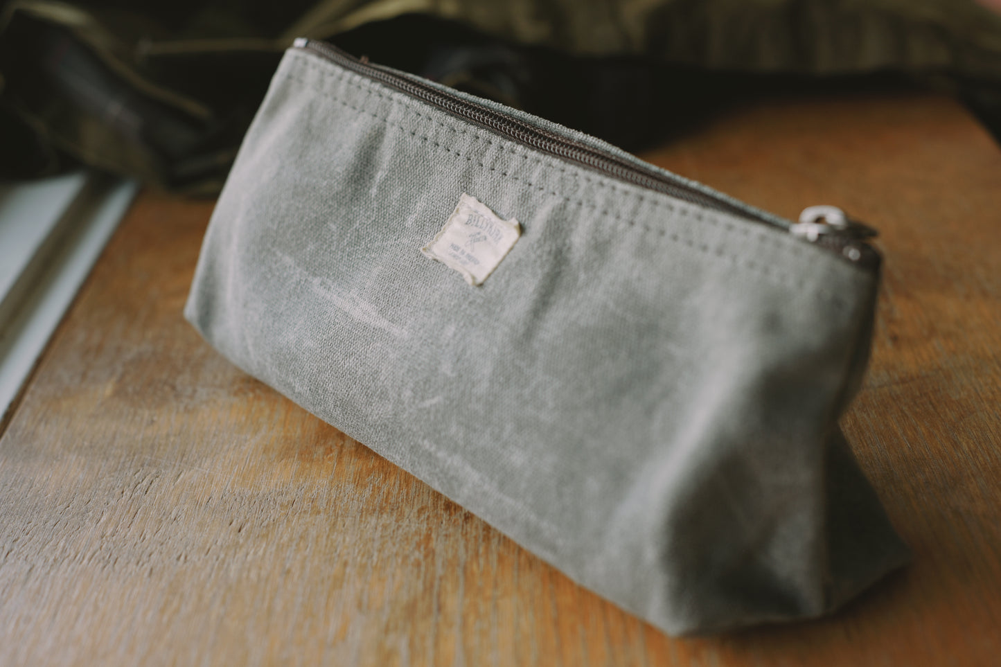 An image of a grey waxed canvas pencil bag made in the usa by Billykirk.