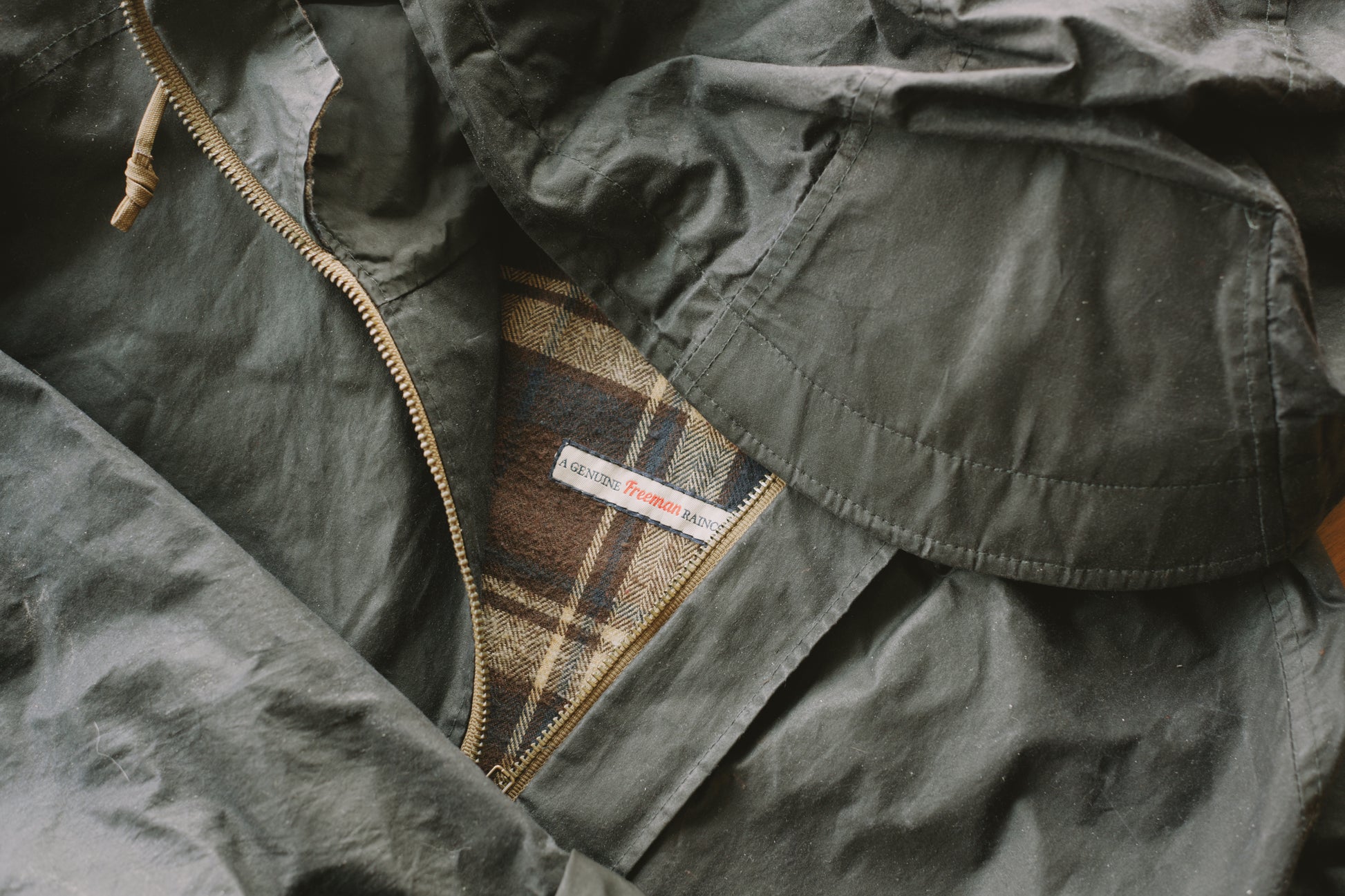 An image of a black waxed cotton Freeman raincoat.